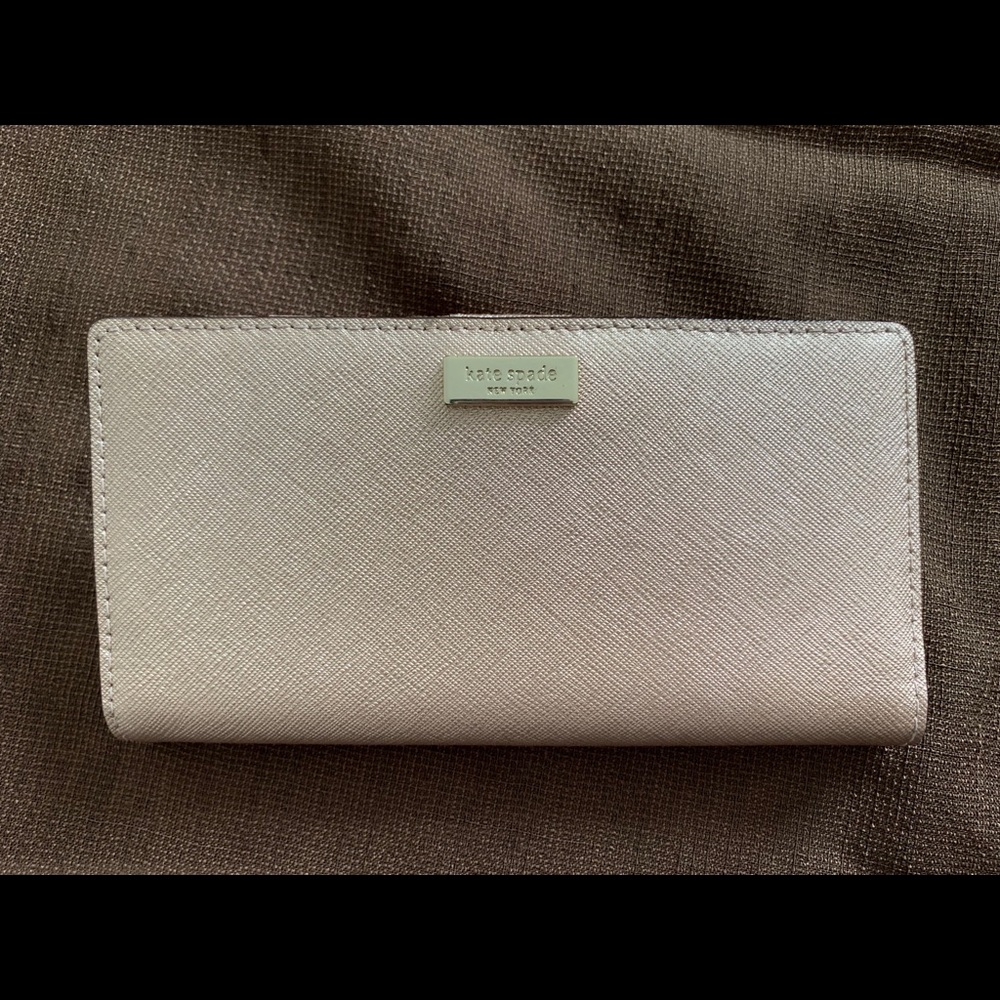 Kate Spade wallet in dull pink color